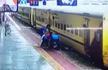 Woman slips trying to board moving train, passengers rescue her, Watch