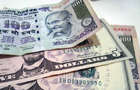 Rupee breaks 61 against dollar, hits record low