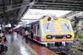 A Vegetable vendor uses umbrella to avert Thane train accident