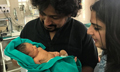 Baby girl left to die in street adopted by two journalists