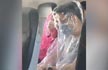 Passengers wrap themselves in plastic on flight over coronavirus