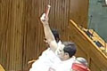 Rahul Gandhi holds up a copy of Constitution while PM Modi takes oath