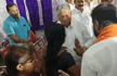 BJP minister slaps woman at an event to distribute land title deeds in Chamarajanagar