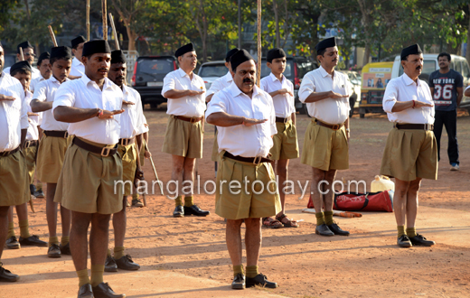 Gujarat state Chief Minister Narendra Modi, center, leaves after a meeting  with Bharatiya Janata Party's parent organization, the Rashtriya  Swayamsevak Sangh (RSS), or the National Volunteers Force's chief Mohan  Bhagwat, unseen, at